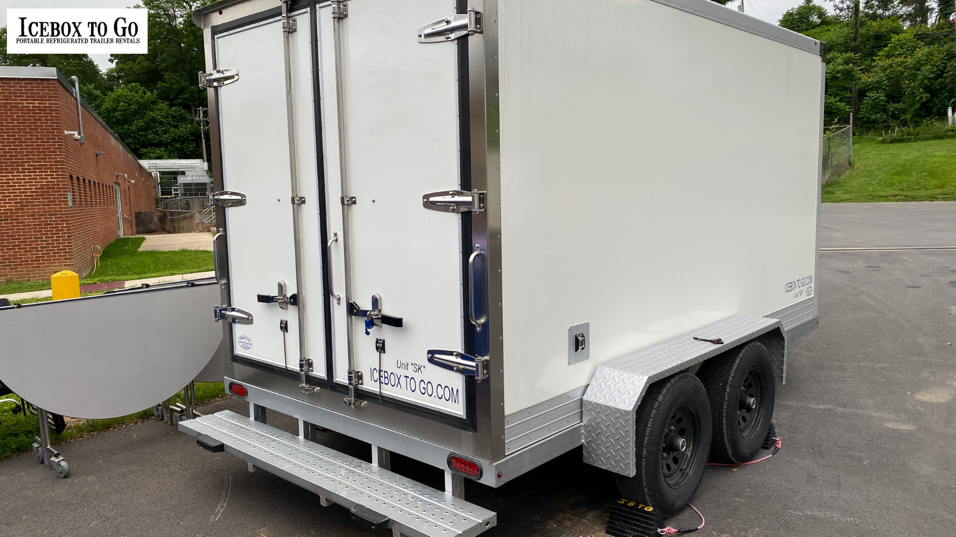 Refrigerated trailer rentals near me for caterers parked at event.